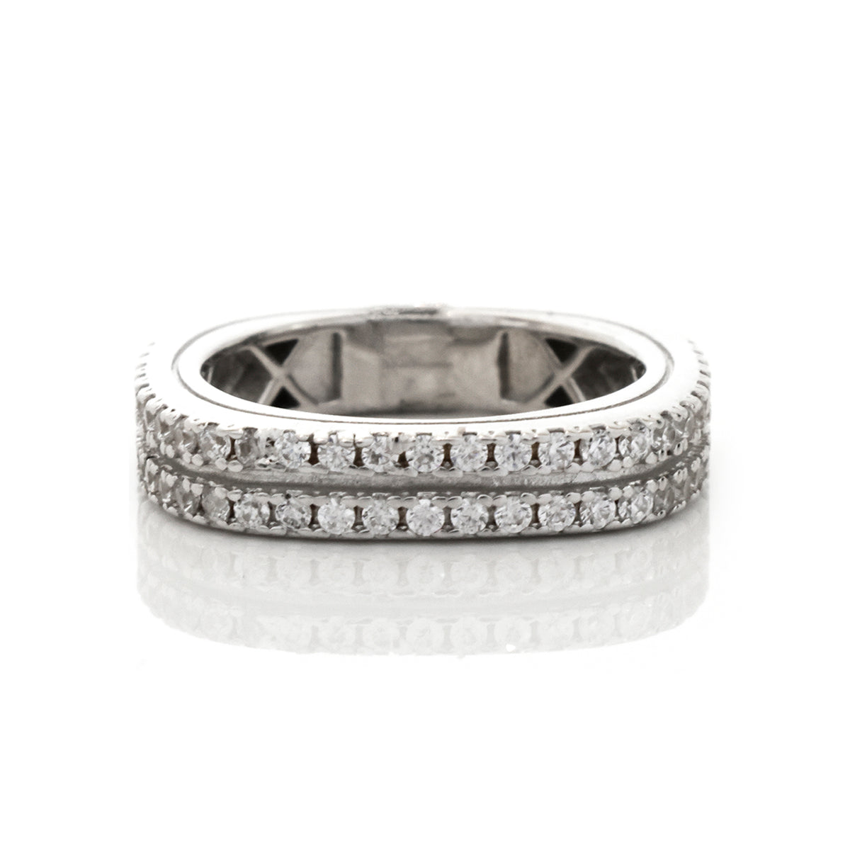 Silver ring with diamond accents on a white background