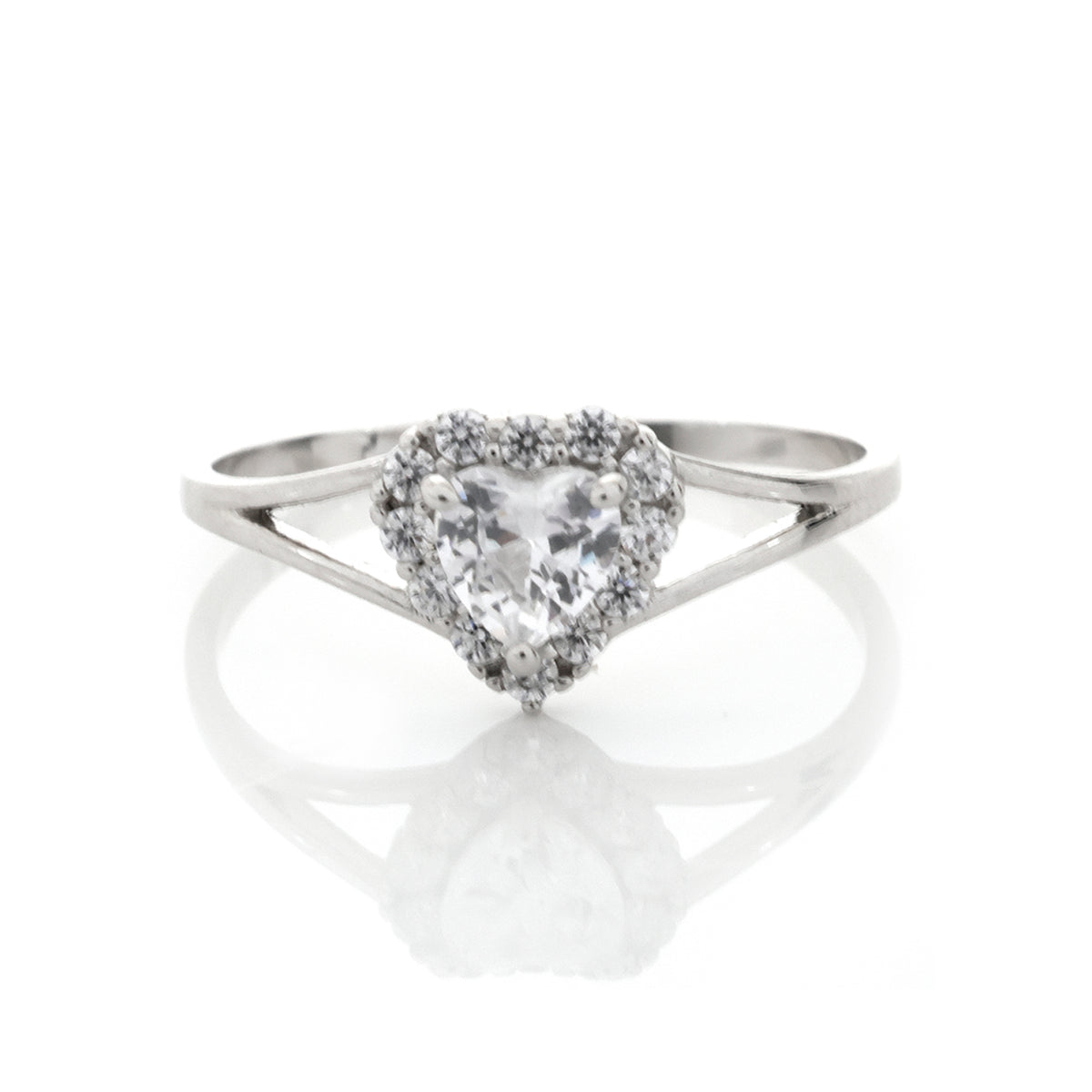 Silver ring with a heart-shaped diamond on a white background