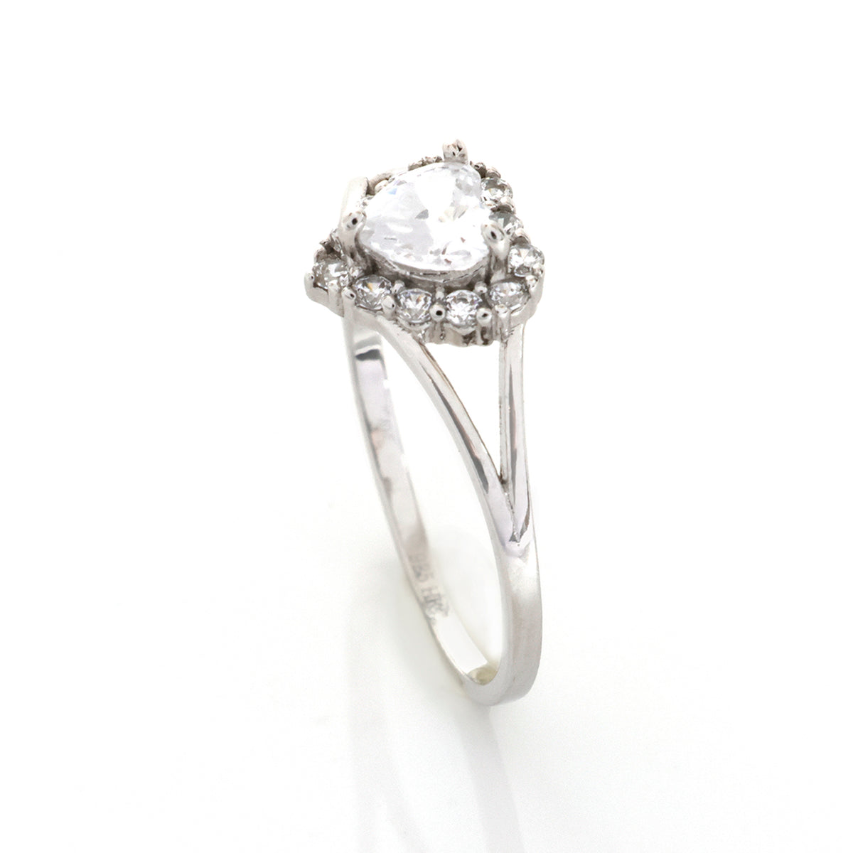 Silver ring with a large central gemstone and smaller stones on a white background
