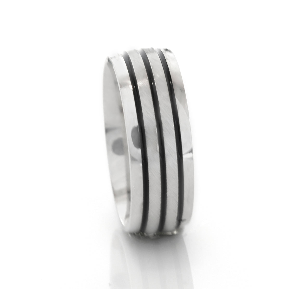 Silver ring with black stripes on a white background
